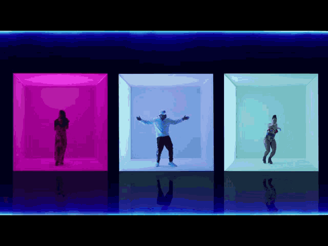 a man in a white hoodie is dancing in a room with three women