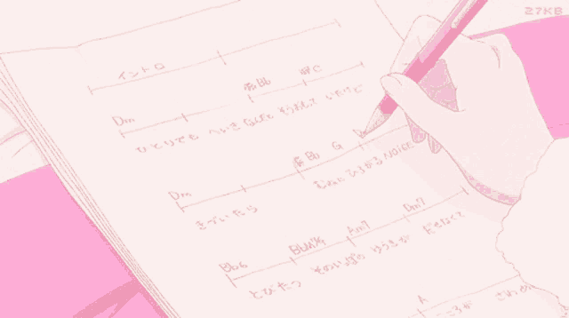 a person is writing on a piece of paper with a pen