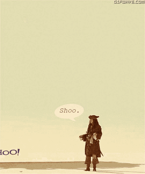 a man in a pirate outfit is standing in front of a yahoo sign