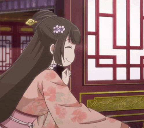a girl with a flower in her hair is standing in front of a window