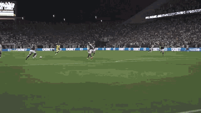 a soccer game is being played in a stadium with advertisements for nike