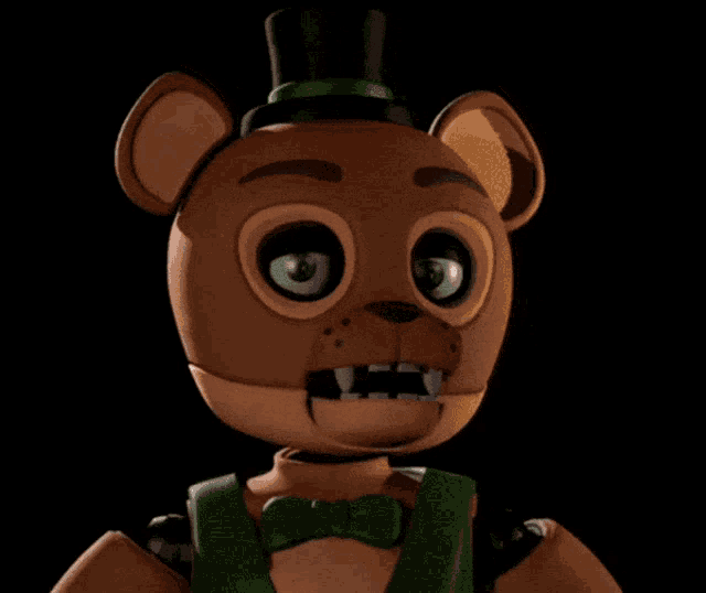 a brown teddy bear with a green bow tie and top hat