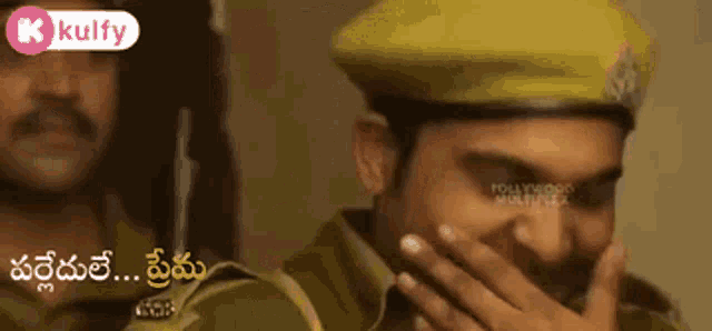 a man in a police uniform is covering his mouth with his hand