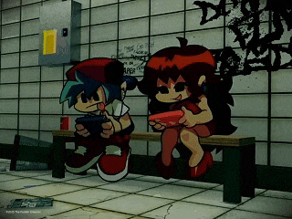 a boy and a girl are sitting on a bench playing a game