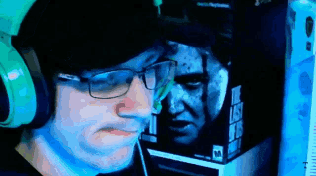 a man wearing headphones looks at a box that says the last of us 2