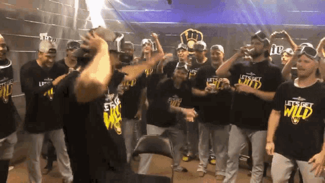 a group of baseball players wearing shirts that say let 's get wild