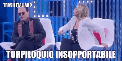 a man and a woman are sitting in chairs with the words trash italiano on the bottom