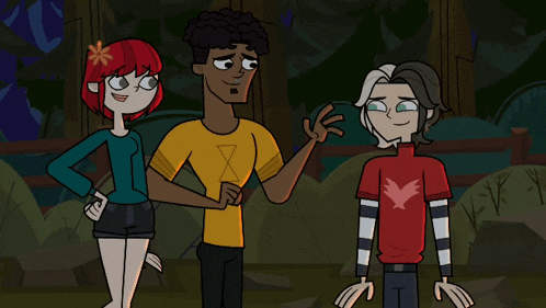 a man in a yellow shirt with an x on it is standing next to two other people