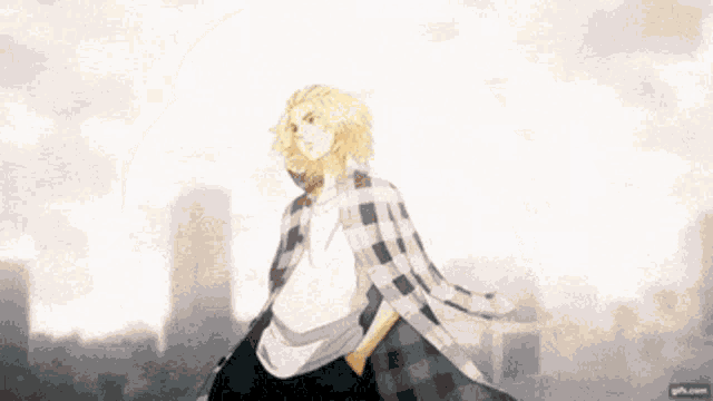 a man in a white shirt and plaid jacket is standing in front of a city .