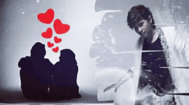 a man stands in front of a silhouette of a couple with hearts coming out of them