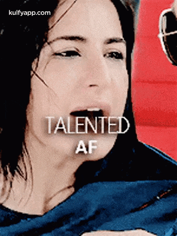 a woman is crying and the words talented af are above her