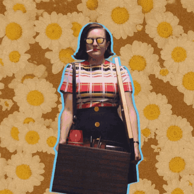 a woman wearing sunglasses and a plaid shirt is standing in front of a floral background