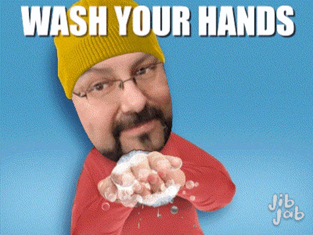 a man with a beard and glasses is washing his hands