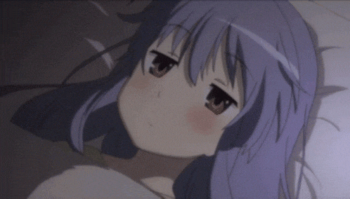 a girl with purple hair is laying in bed