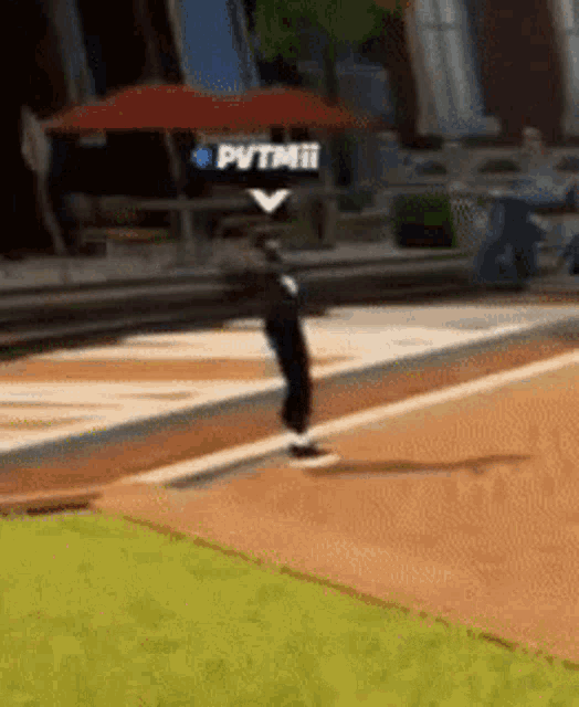 a person is doing a trick on a skateboard in a video game while another person watches .