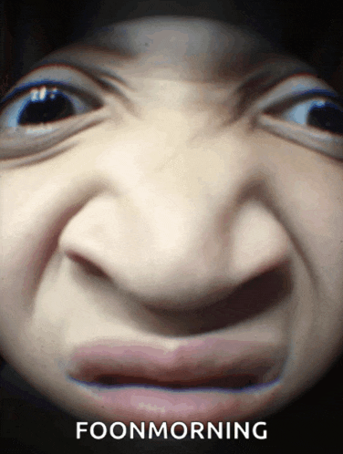 a close up of a person 's face with the words foonmorning written below it