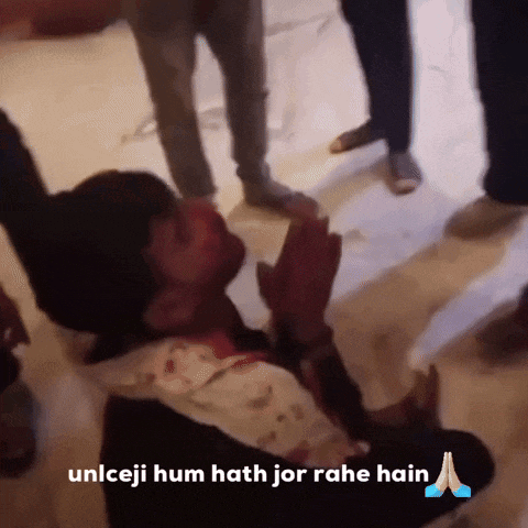a man is kneeling on the floor with his hands folded and the words unlceji hum hath jor rahe hain above him