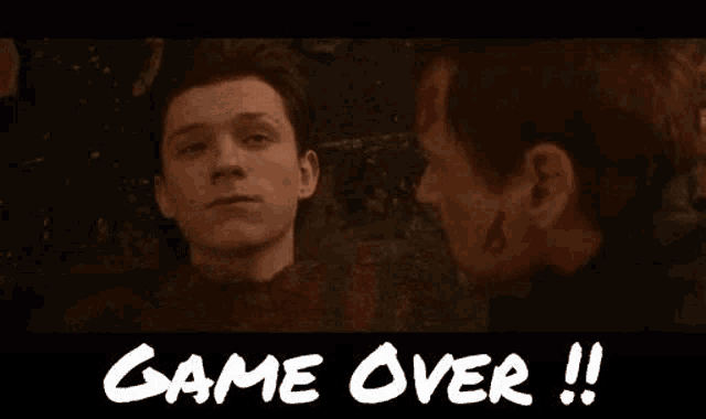 a man and a woman are standing next to each other and the words `` game over '' are written on the bottom .