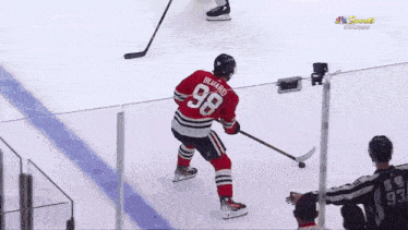 a hockey player with the number 68 on his shirt
