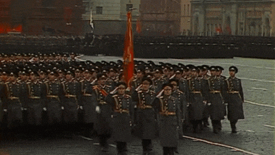 a group of soldiers marching down a street