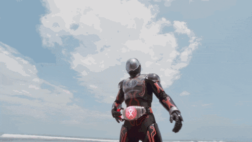 a man in a superhero costume with a belt that says x on it
