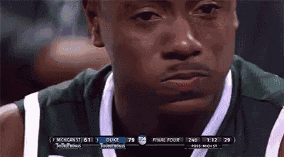 a close up of a man 's face during a basketball game