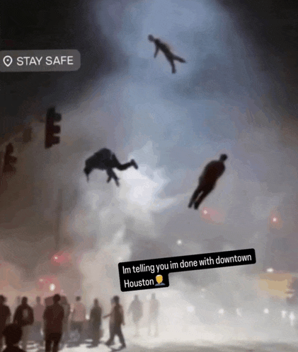 a group of people are flying through the air with a stay safe sticker