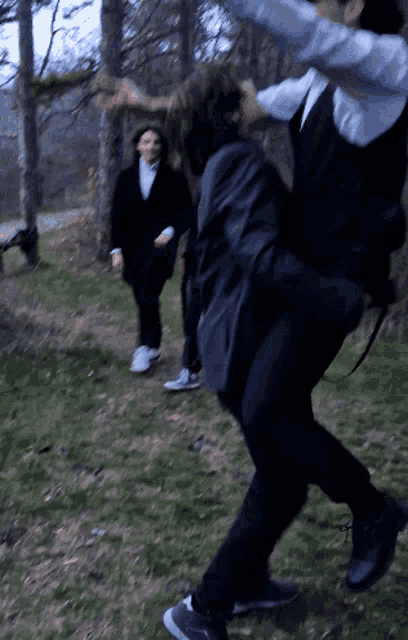 a blurry photo of a man carrying another man