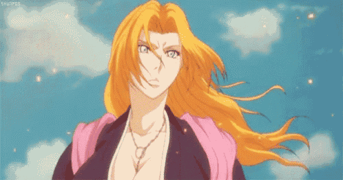 a woman with long blonde hair is standing in front of a blue sky and clouds .