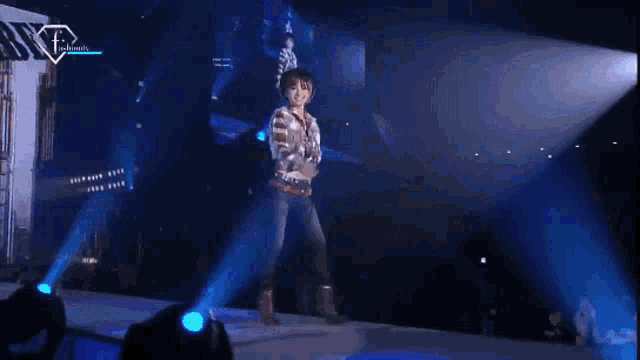 a woman in a plaid shirt is walking down the runway