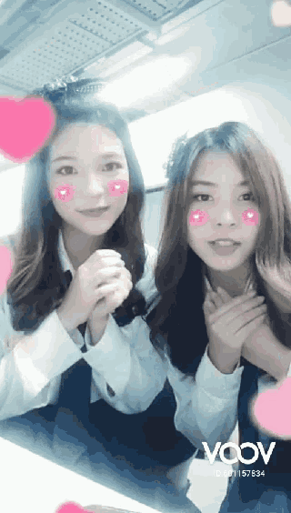 two girls with hearts on their faces and the word vcov
