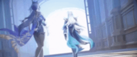 a blurry picture of two women standing next to each other in a room .