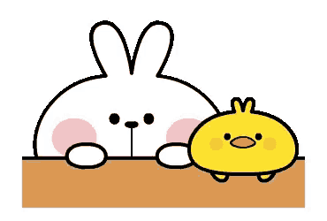 a rabbit and a chick are sitting on a table .