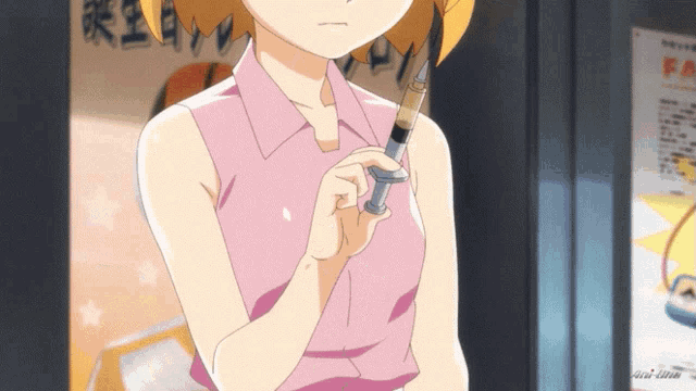 a girl in a pink shirt holding a syringe