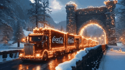 a coca cola truck is driving through a tunnel with christmas lights