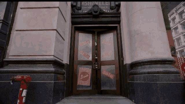 a building with a sign on the door that says sale