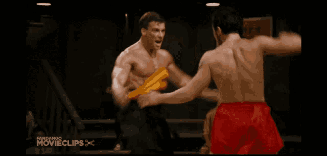 two men are fighting in a boxing ring and the words movieclips are on the bottom