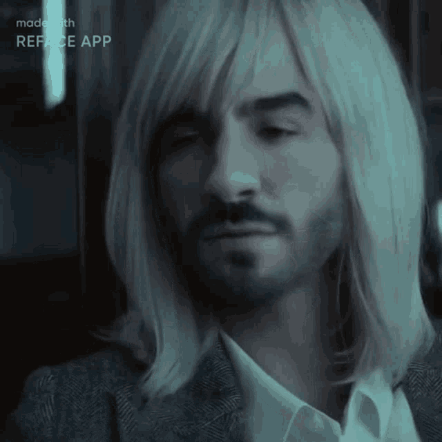 a man with long blonde hair and a beard is being made with reface app