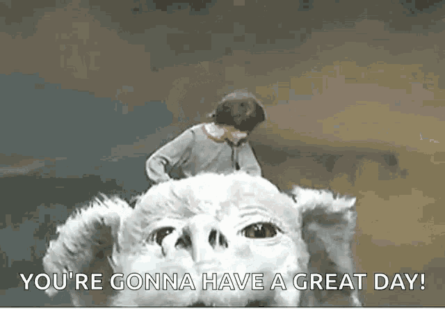 a man is riding on the back of a large white dog .