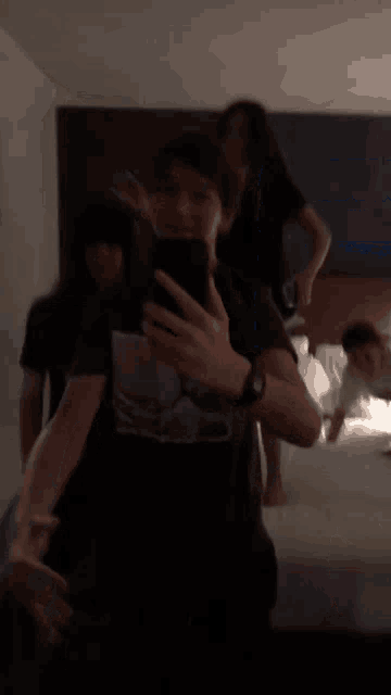 a man taking a picture of himself with his phone
