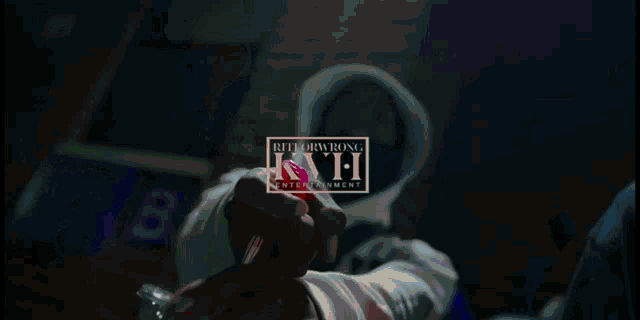 a blurry picture of a woman 's face with the words international kaff entertainment written on it