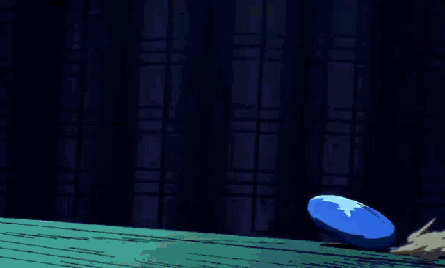 a cartoon character 's feet are shown with a blue ball behind them