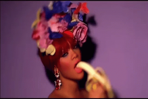 Rihanna Eating Banana GIF - Rihanna Eating Banana Flower Hat GIFs