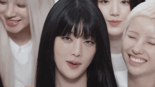 a group of young women are posing for a picture and one of them has a fringe