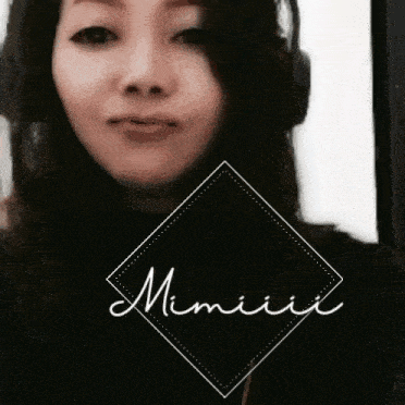a woman wearing headphones has the word mimiii written in a diamond
