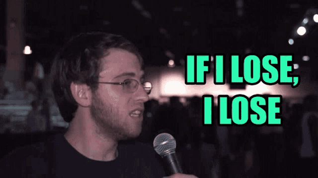 a man speaking into a microphone with the words if i lose i lose