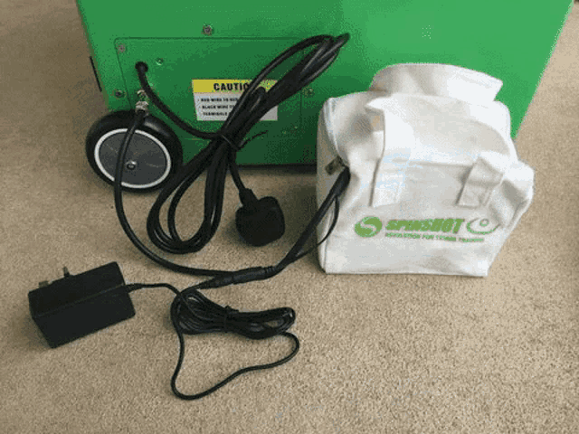 a bag that says spinshot on it is next to a green box