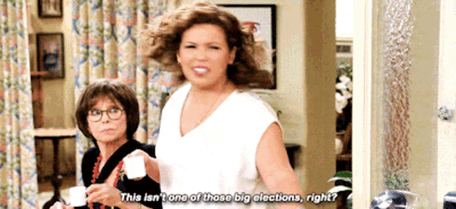 two women are standing next to each other and one of them says this isn 't one of those big elections right