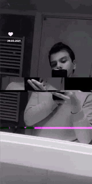 a man is taking a picture of himself in a mirror while holding a cell phone .