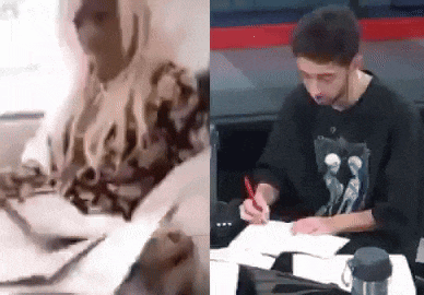 a woman is sitting at a table and a man is sitting at a table writing on a piece of paper .